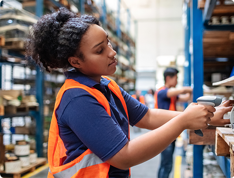 Warehouse worker scans inventory