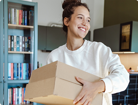 Woman receives package at home